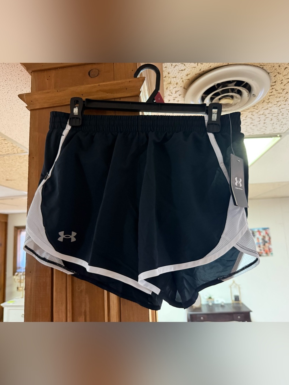 Under Armour Women’s Black Athletic Shorts with White Accents